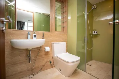 a bathroom with a toilet and a sink and a shower at Vortex KLCC by Luxury Suites Asia in Kuala Lumpur