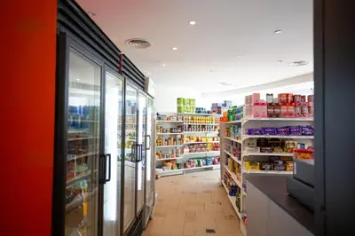 a aisle of a grocery store with shelves of food at Vortex KLCC by Luxury Suites Asia in Kuala Lumpur