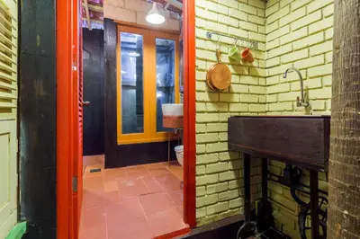 a bathroom with a sink and a toilet at Classic Malay House in KL City Centre in Kuala Lumpur