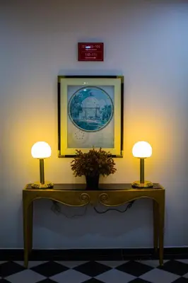 two lamps on a table with a picture on the wall at Akar Hotel Jalan TAR in Kuala Lumpur