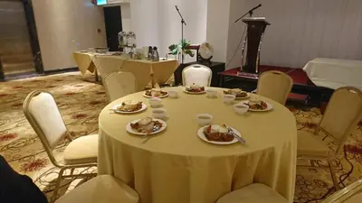 a dining room with a table with food on it at InnB Park Hotel in Kuala Lumpur