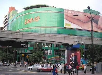 a large building with people walking in front of it at InnB Park Hotel in Kuala Lumpur