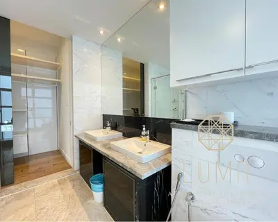 a bathroom with two sinks and a large mirror at The Platinum Kuala Lumpur by LUMA in Kuala Lumpur