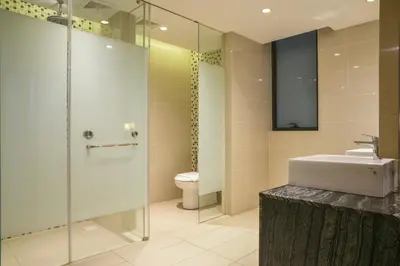 a bathroom with a shower and a sink and a toilet at D'Majestic Place by Widebed in Kuala Lumpur