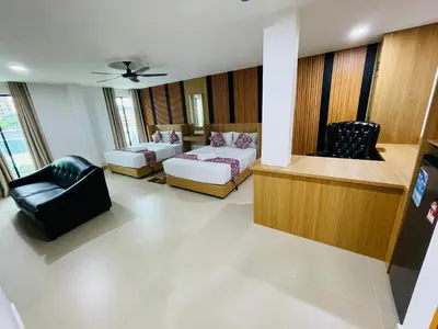 a living room with two couches and two chairs at Cozy Hotel@ KL Sentral in Kuala Lumpur