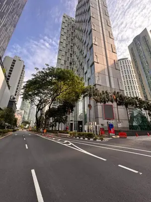 an empty street in a city with tall buildings at Soho Suites KLCC by Leala in Kuala Lumpur