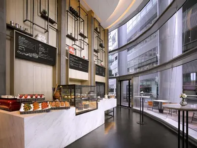 a bakery with a display case in a building at Sofitel Kuala Lumpur Damansara in Kuala Lumpur