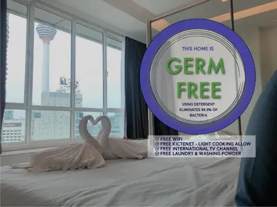 two swans in a bed with a sign that says gem free at Parkview Suite KLCC, Bernice in Kuala Lumpur