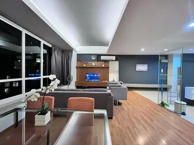 a living room with a couch and a table at Parkview Suite KLCC, Bernice in Kuala Lumpur