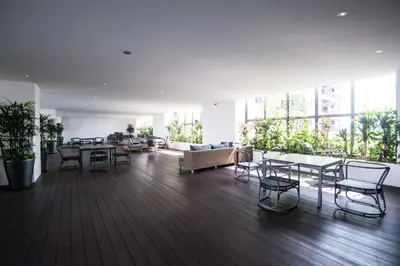 a large room with chairs and tables and windows at KL Sentral Bangsar Suites EST BY PSM LUXURY SUITES in Kuala Lumpur