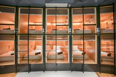 a room filled with lots of bunk beds at The Bed KLCC in Kuala Lumpur