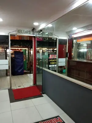 an entrance to a store with a red door at Petaling Street Hotel Chinatown in Kuala Lumpur