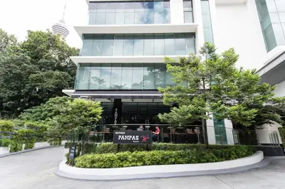 a building with a sign in front of it at Apartment by WGS Homestay Bukit Bintang in Kuala Lumpur