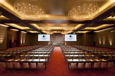 an empty lecture hall with tables and chairs at DoubleTree By Hilton Kuala Lumpur in Kuala Lumpur