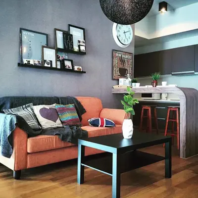 a living room with a couch and a table at Suites & Residences @ Regalia by PLC in Kuala Lumpur