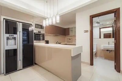 a kitchen with a counter and a sink at Suites & Residences @ Regalia by PLC in Kuala Lumpur