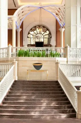 a stairway in a building with a fountain at Sheraton Imperial Kuala Lumpur Hotel in Kuala Lumpur