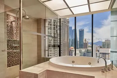 a bathroom with a tub and a large window at The Westin Kuala Lumpur in Kuala Lumpur