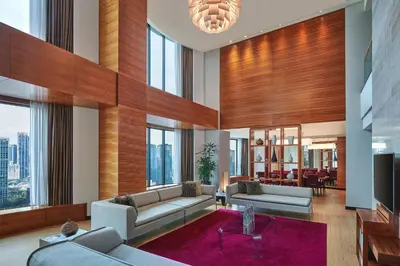 a living room with couches and a table at The Westin Kuala Lumpur in Kuala Lumpur