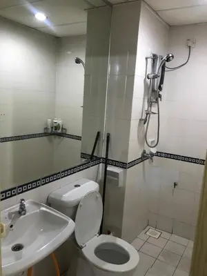a bathroom with a shower and a toilet and a sink at Maytower Service Suite - Masjid India in Kuala Lumpur