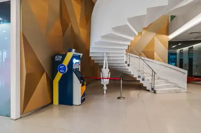 a building with a gas pump and a staircase at Summer Suites KLCC Apartments by soulasia in Kuala Lumpur