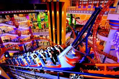 a carnival ride with people on a roller coaster at Kingston Hotel 1 - Bukit Bintang in Kuala Lumpur