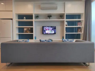 a living room with a couch and a tv at KL Platinum KLCC By Hive KL in Kuala Lumpur