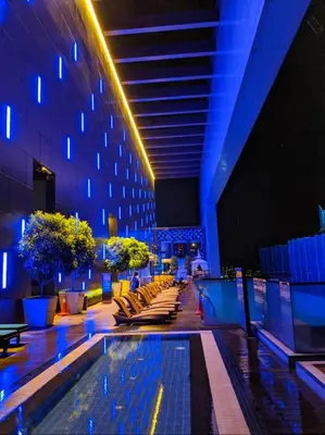 a hotel lobby with a swimming pool and a building at KL Platinum KLCC By Hive KL in Kuala Lumpur