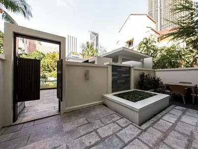 a patio with an open door and a garden at Micasa All Suites Hotel in Kuala Lumpur