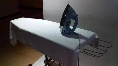 a iron sitting on top of a white table at Hotel China Town 2 in Kuala Lumpur