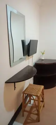 a bathroom with a desk and a stool and a mirror at Hotel China Town 2 in Kuala Lumpur