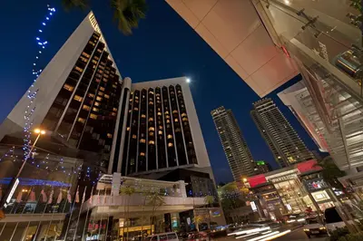 a view of a city at night with tall buildings at Grand Millennium Kuala Lumpur in Kuala Lumpur