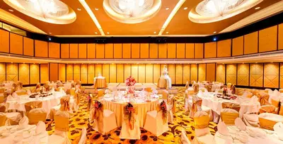 a large banquet hall with white tables and chairs at Grand Millennium Kuala Lumpur in Kuala Lumpur