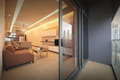 a living room with a couch and a dining room at Dorsett Kuala Lumpur in Kuala Lumpur