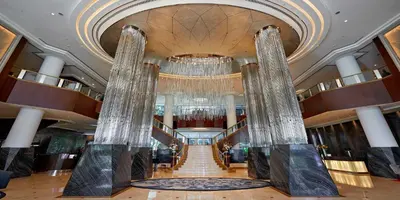 a large lobby with a staircase in a building at InterContinental Kuala Lumpur by IHG in Kuala Lumpur