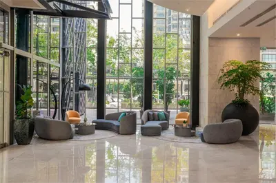 a lobby with chairs and plants in a building at St Giles Boulevard in Kuala Lumpur