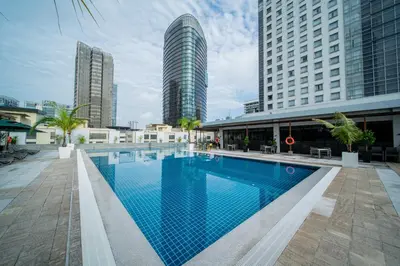 a large swimming pool in a city with tall buildings at St Giles Boulevard in Kuala Lumpur