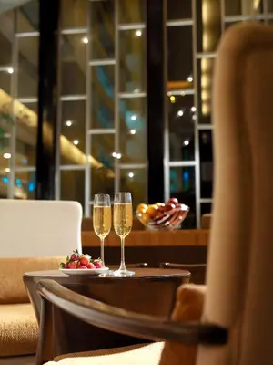 two glasses of champagne on a table in a restaurant at St Giles Boulevard in Kuala Lumpur