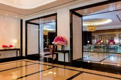 a lobby of a hotel with a vase of flowers at The Ritz-Carlton, Kuala Lumpur in Kuala Lumpur