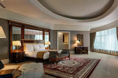 a hotel room with a bed and a desk at JW Marriott Kuala Lumpur in Kuala Lumpur
