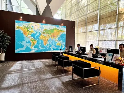 a lobby with a large world map on the wall at Hotel Maya Kuala Lumpur City Centre in Kuala Lumpur