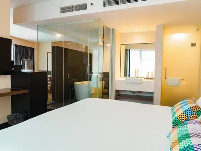 a bathroom with a large glass shower and a sink at Starus Hotel Bukit Bintang in Kuala Lumpur
