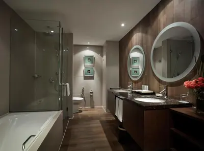 a bathroom with two sinks and a tub and a shower at Sunway Putra Hotel Kuala Lumpur in Kuala Lumpur
