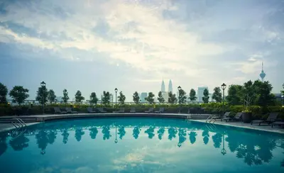 a swimming pool with a view of the city at Sunway Putra Hotel Kuala Lumpur in Kuala Lumpur