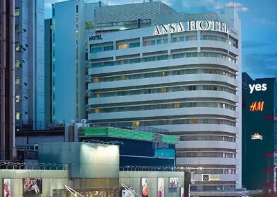 a large building with an amazon hotels sign on it at ANSA Hotel Kuala Lumpur in Kuala Lumpur