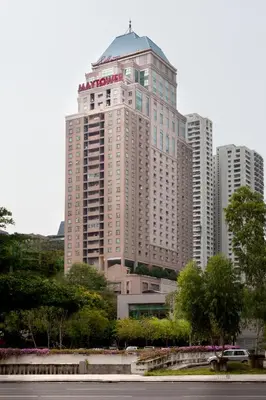 a large building with a sign on the top of it at Silka Maytower Kuala Lumpur in Kuala Lumpur