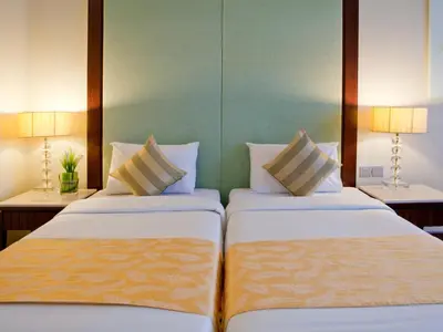 two beds sitting next to each other in a hotel room at Silka Maytower Kuala Lumpur in Kuala Lumpur