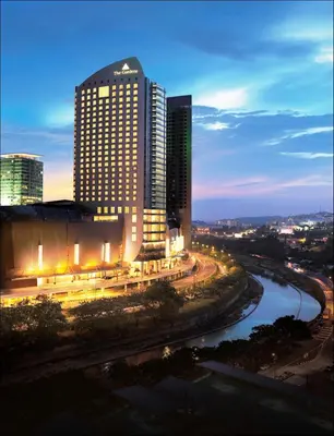 a city skyline at night with a river and buildings at St Giles Mid Valley Kuala Lumpur in Kuala Lumpur
