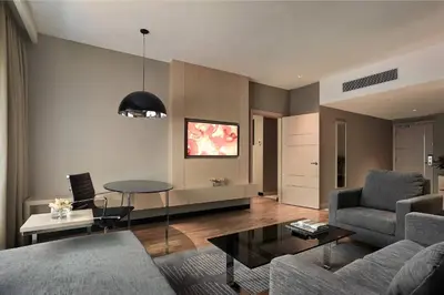 a living room with a couch and a table at Renaissance Kuala Lumpur Hotel & Convention Centre in Kuala Lumpur