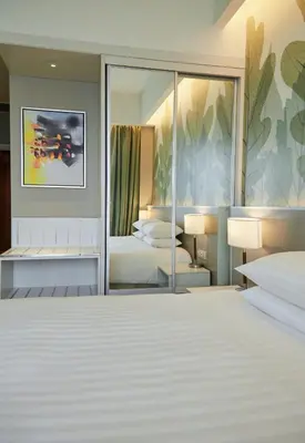 a rendering of a bedroom with two beds and a mirror at Sunway Velocity Hotel Kuala Lumpur in Kuala Lumpur